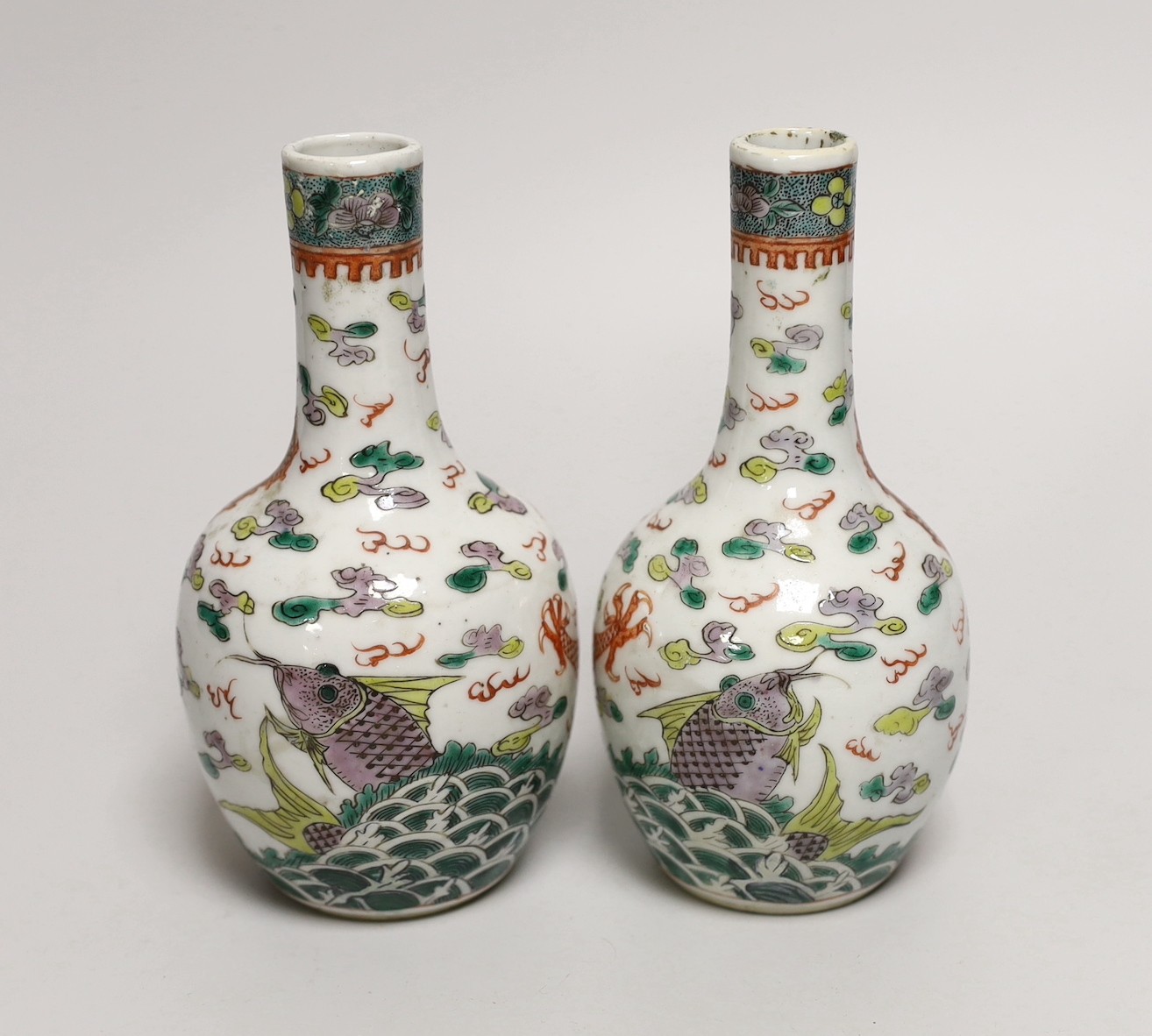 A pair of Chinese enamelled porcelain ‘dragon’ bottle vases, Kangxi marks probably Guangxu period, 15cms high (a.f.)